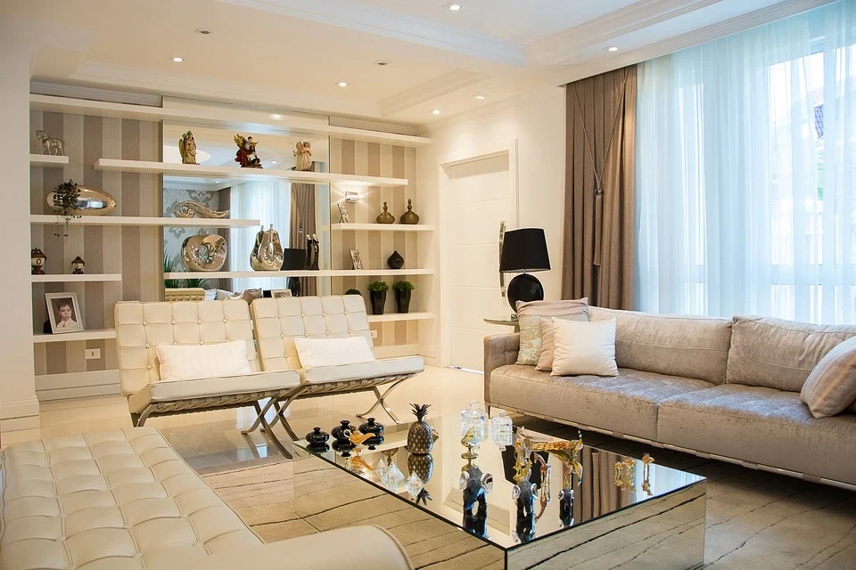 a photo of a living room with white furnitures
