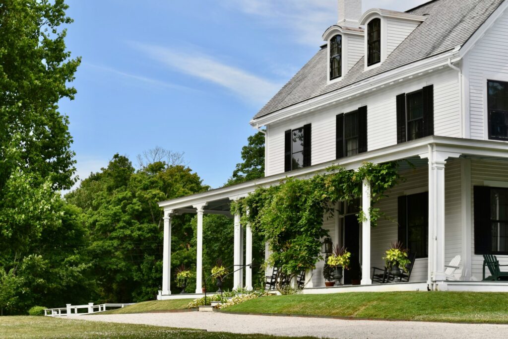a large white house with porch