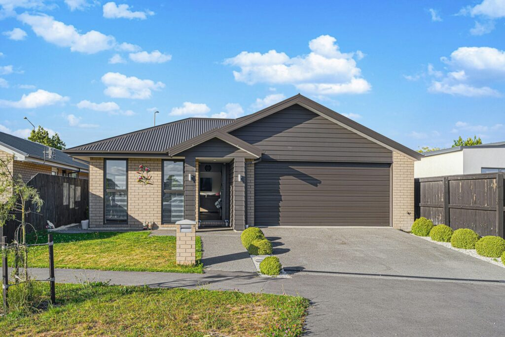 a house with a driveway in front of it